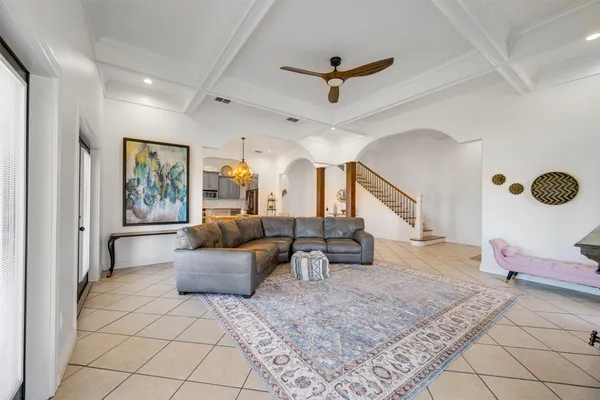 a bedroom with furniture and a flat screen tv