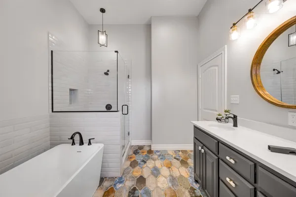 a bathroom with a sink mirror and toilet