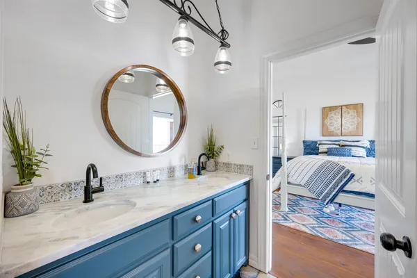 a bedroom with a bed and a dresser