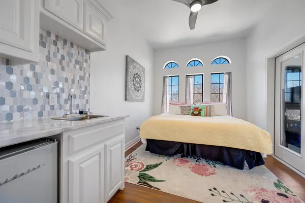 a bed room with a bed and a book shelf