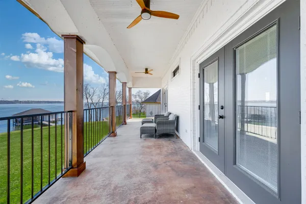 a view of swimming pool with sitting area