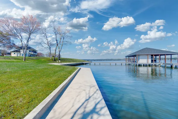 a view of a swimming pool with a yard