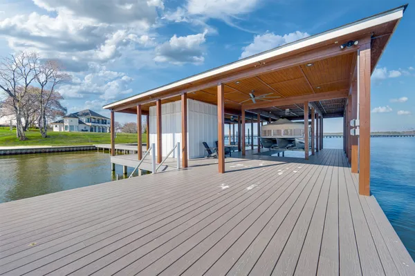 a view of a balcony with wooden floor