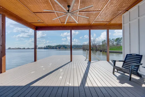 a view of a lake with houses in the back