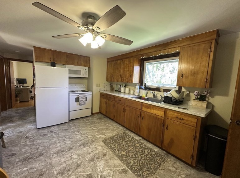 224 Berlin Street, Unit 2 Clinton, MA 01510 - Photo 1 of 5 a kitchen with appliances cabinets and a sink