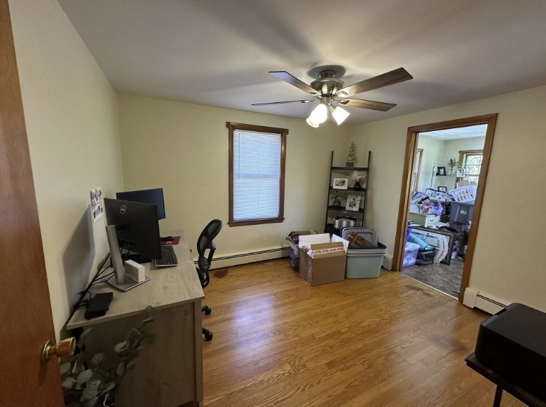 224 Berlin Street, Unit 2 Clinton, MA 01510 - Photo 3 of 5 a view of workspace with wooden floor