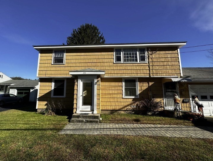 224 Berlin Street, Unit 2 Clinton, MA 01510 - Photo 4 of 5 a front view of a house