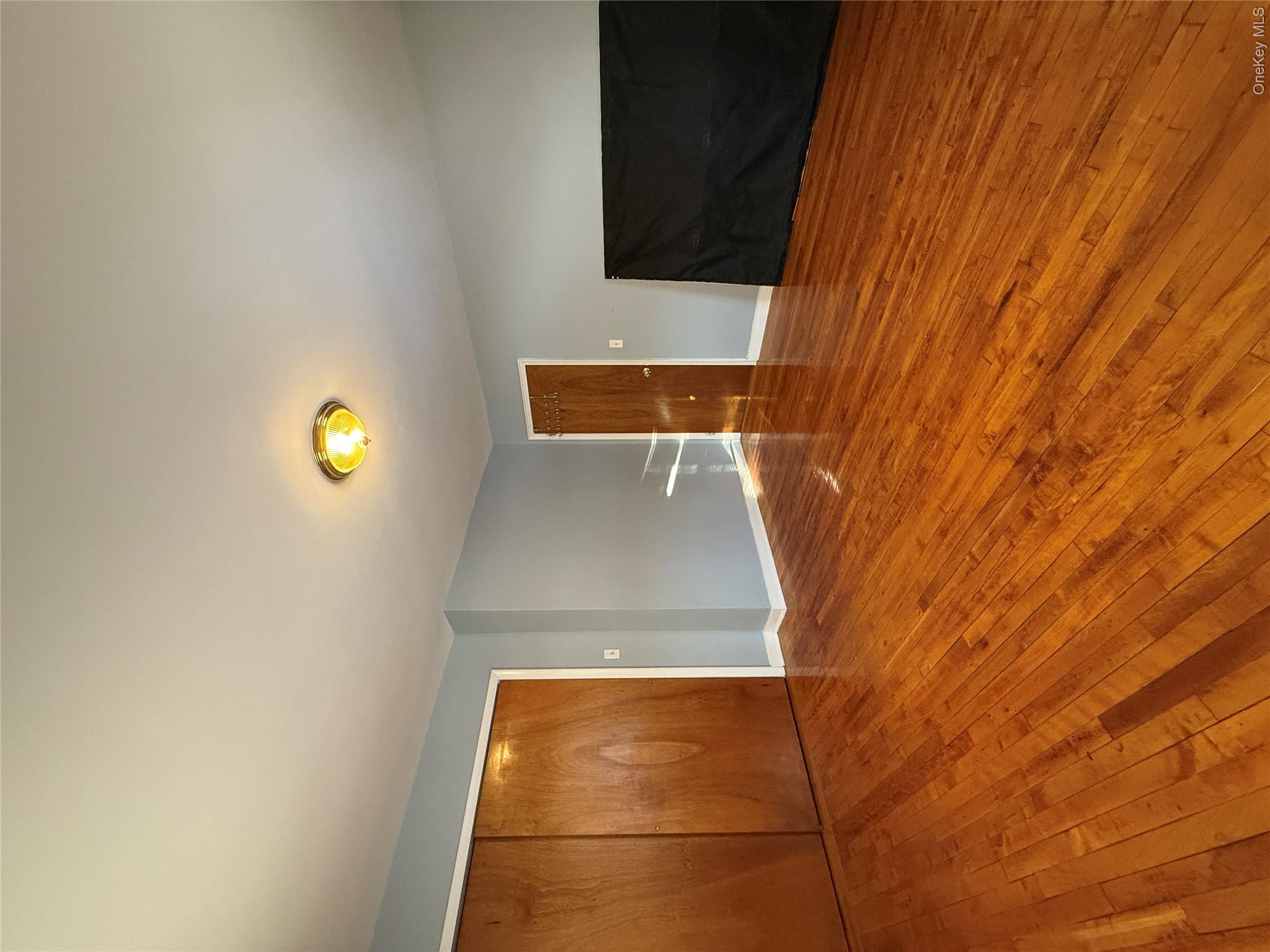 110-51 64th Road, Unit 25 Queens, NY 11375 - Photo 23 of 24 a view of empty room with wooden floor
