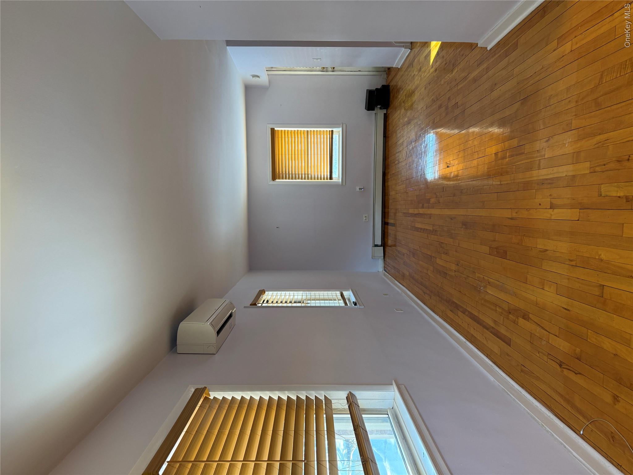 110-51 64th Road, Unit 25 Queens, NY 11375 - Photo 7 of 24 a view of an empty room and window