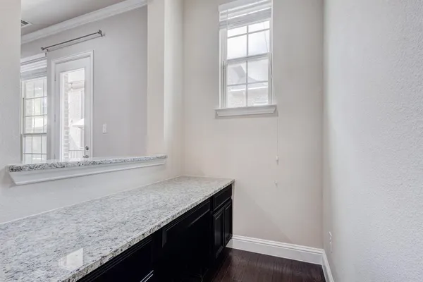 a kitchen with kitchen island a sink and refrigerator