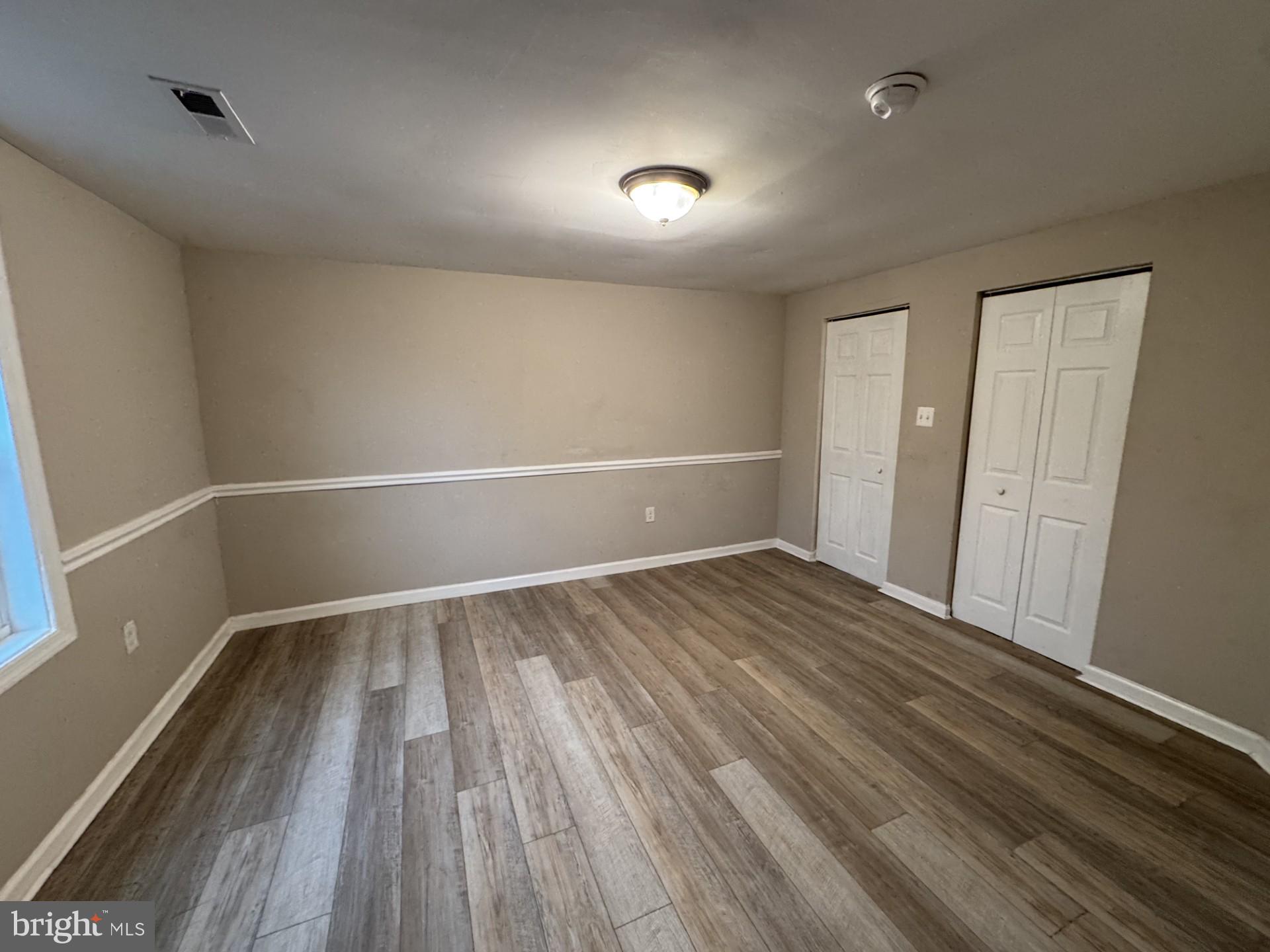 3920 Main Street, Unit A Trappe, MD 21673 - Photo 11 of 16 a view of an empty room and wooden floor