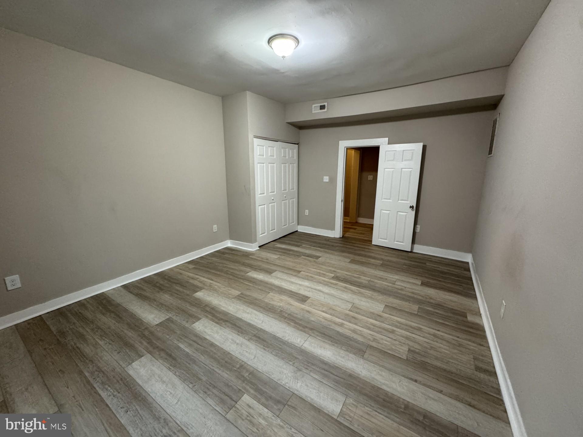 3920 Main Street, Unit A Trappe, MD 21673 - Photo 14 of 16 wooden floor in an empty room