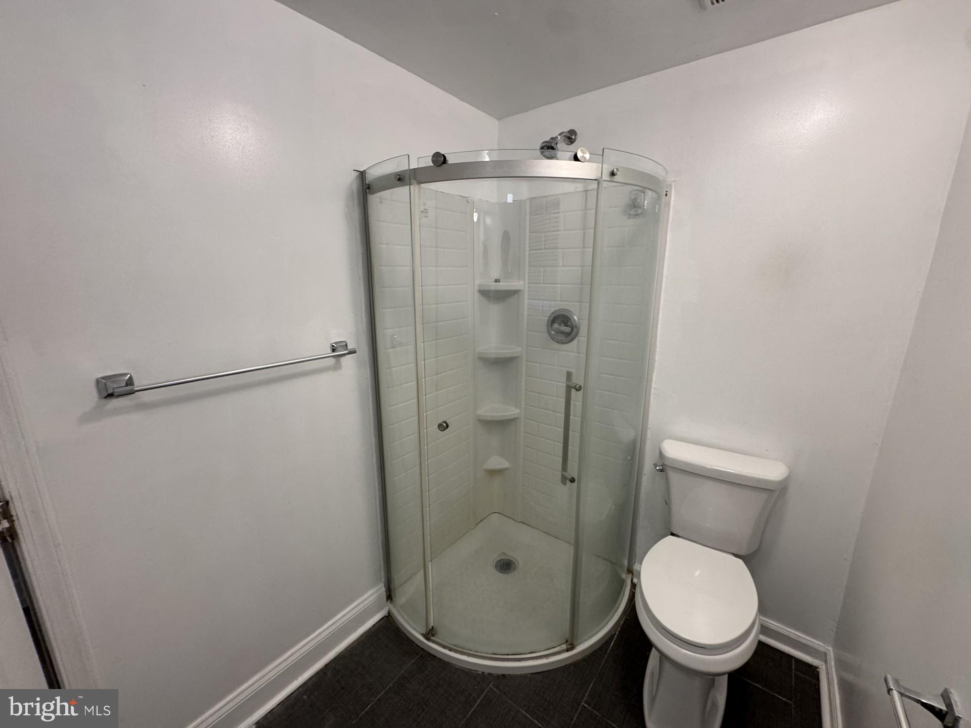 3920 Main Street, Unit A Trappe, MD 21673 - Photo 10 of 16 a bathroom with a toilet and a shower