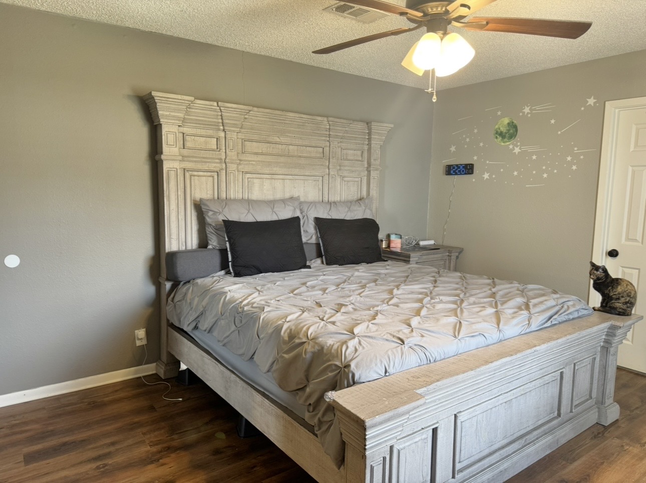 612 Cardinal Street Elgin, TX 78621 - Photo 13 of 28 Bedroom featuring dark wood-type flooring, a textured ceiling, and ceiling fan