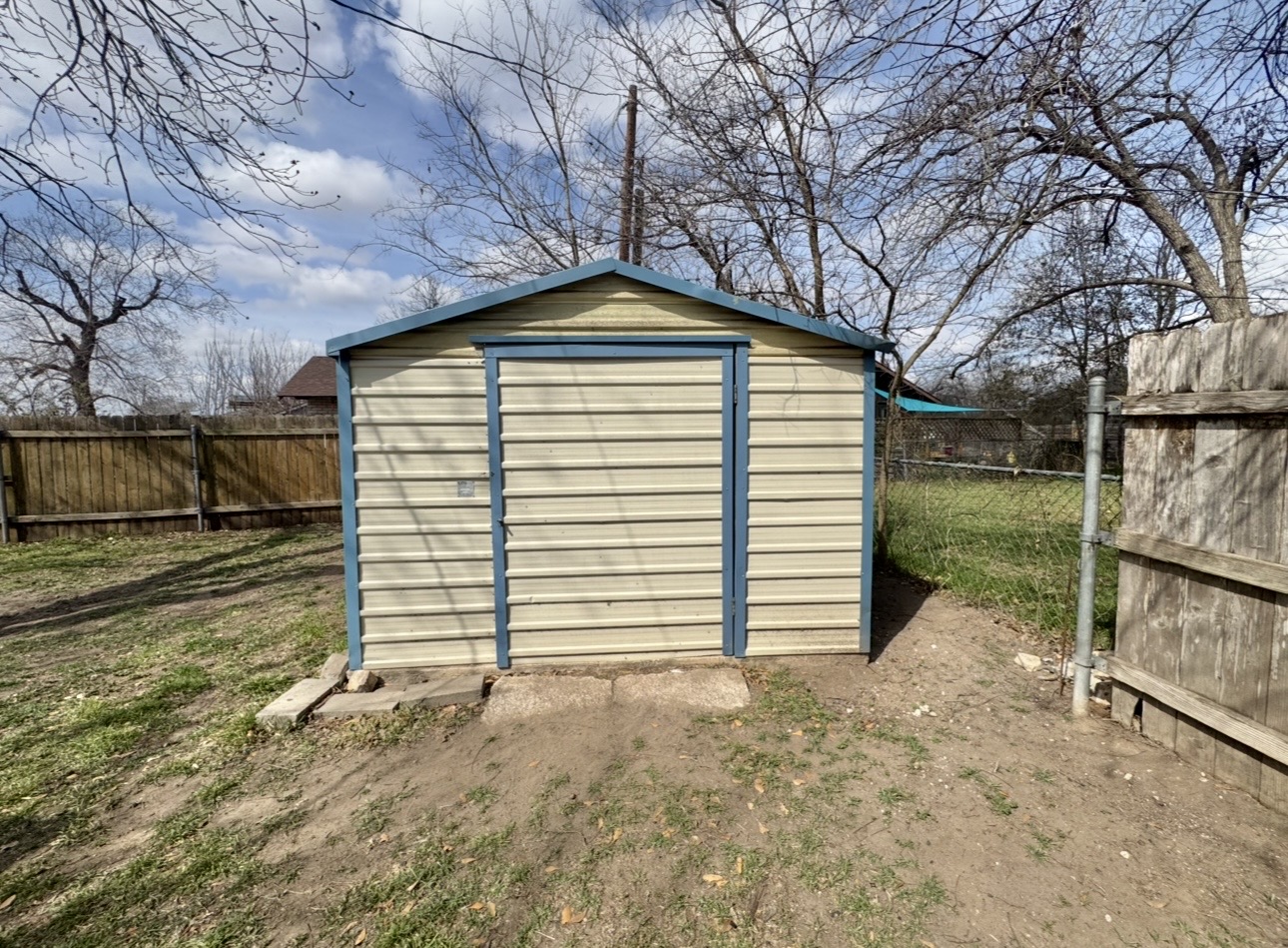 612 Cardinal Street Elgin, TX 78621 - Photo 28 of 28 View of shed with a fenced backyard