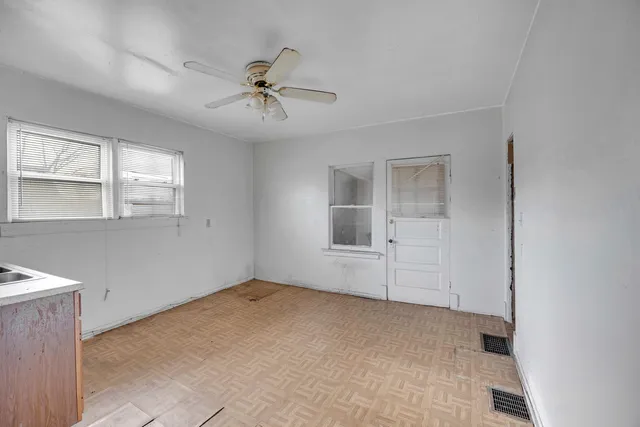 a kitchen with stainless steel appliances granite countertop a sink and a refrigerator