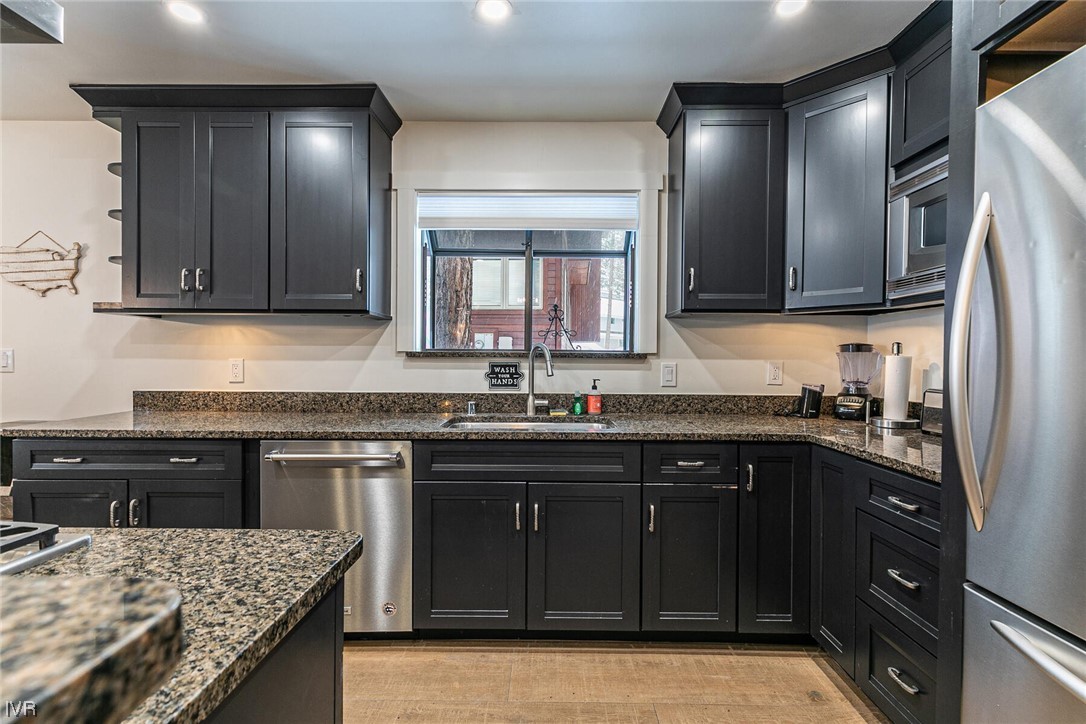 771 Golfers Pass Road Incline Village, NV 89451 - Photo 12 of 26 a kitchen with a sink stove and refrigerator