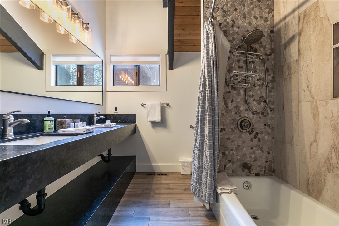 771 Golfers Pass Road Incline Village, NV 89451 - Photo 15 of 26 a bathroom with a bathtub sink and mirror
