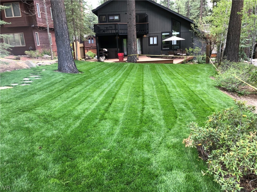 771 Golfers Pass Road Incline Village, NV 89451 - Photo 26 of 26 a view of a patio with table and chairs and a large tree