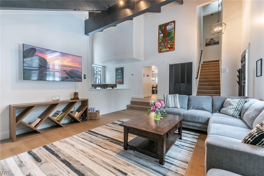 771 Golfers Pass Road Incline Village, NV 89451 - Photo 7 of 26 a living room with furniture a rug and a flat screen tv