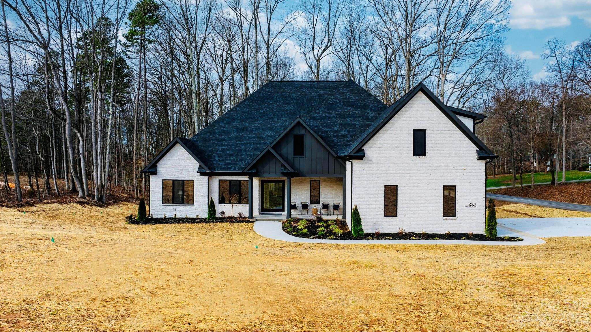 a view of a house with snow on the wall