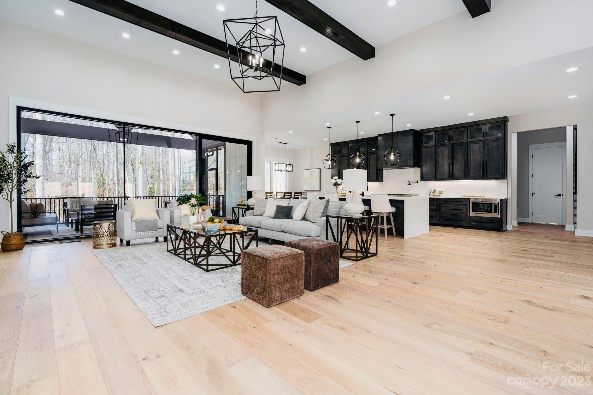 8527 Fieldstone Drive Terrell, NC 28682 - Photo 13 of 48 a living room with furniture a flat screen tv and kitchen view