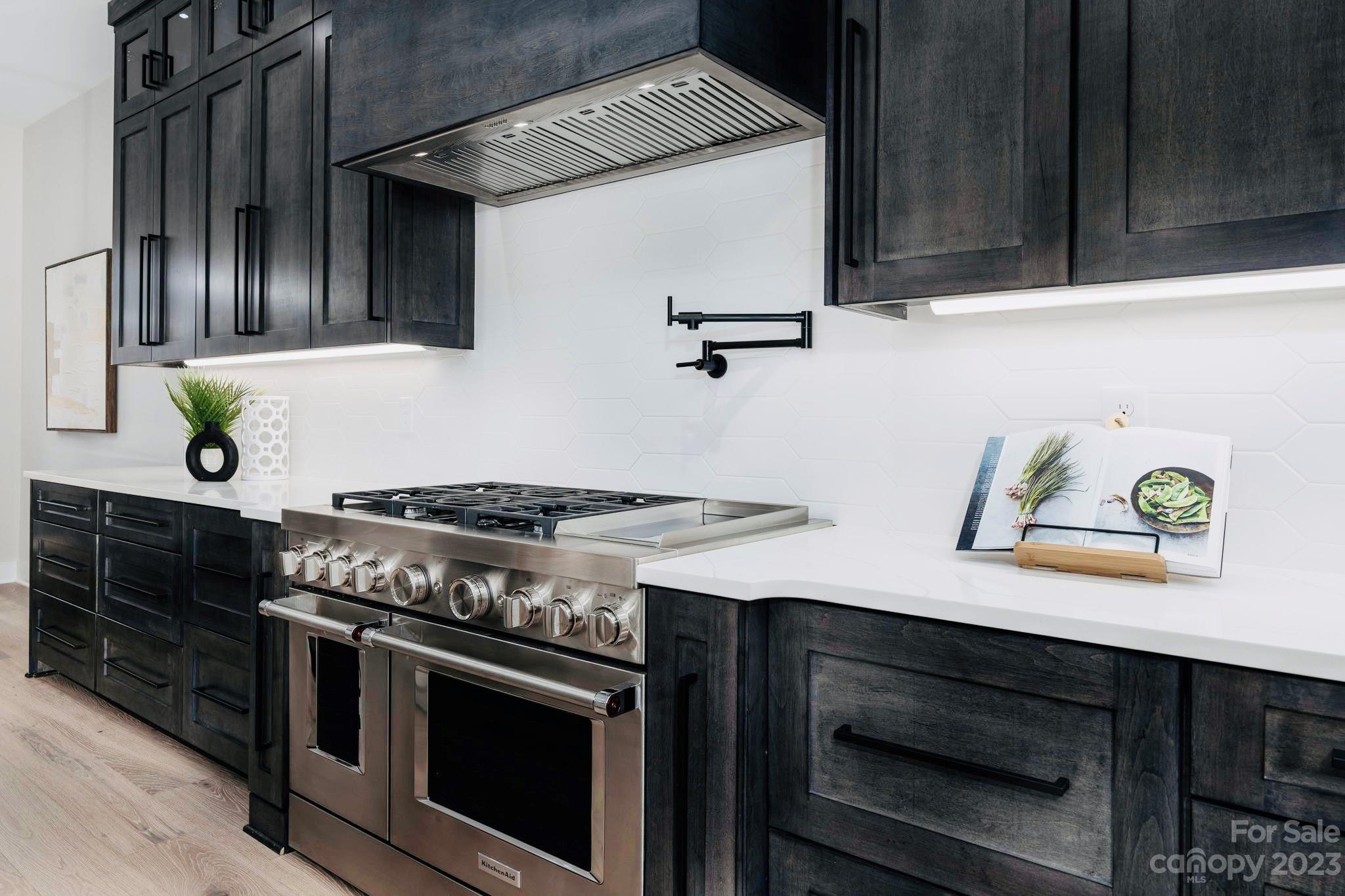 8527 Fieldstone Drive Terrell, NC 28682 - Photo 18 of 48 a stove top oven sitting inside of a kitchen