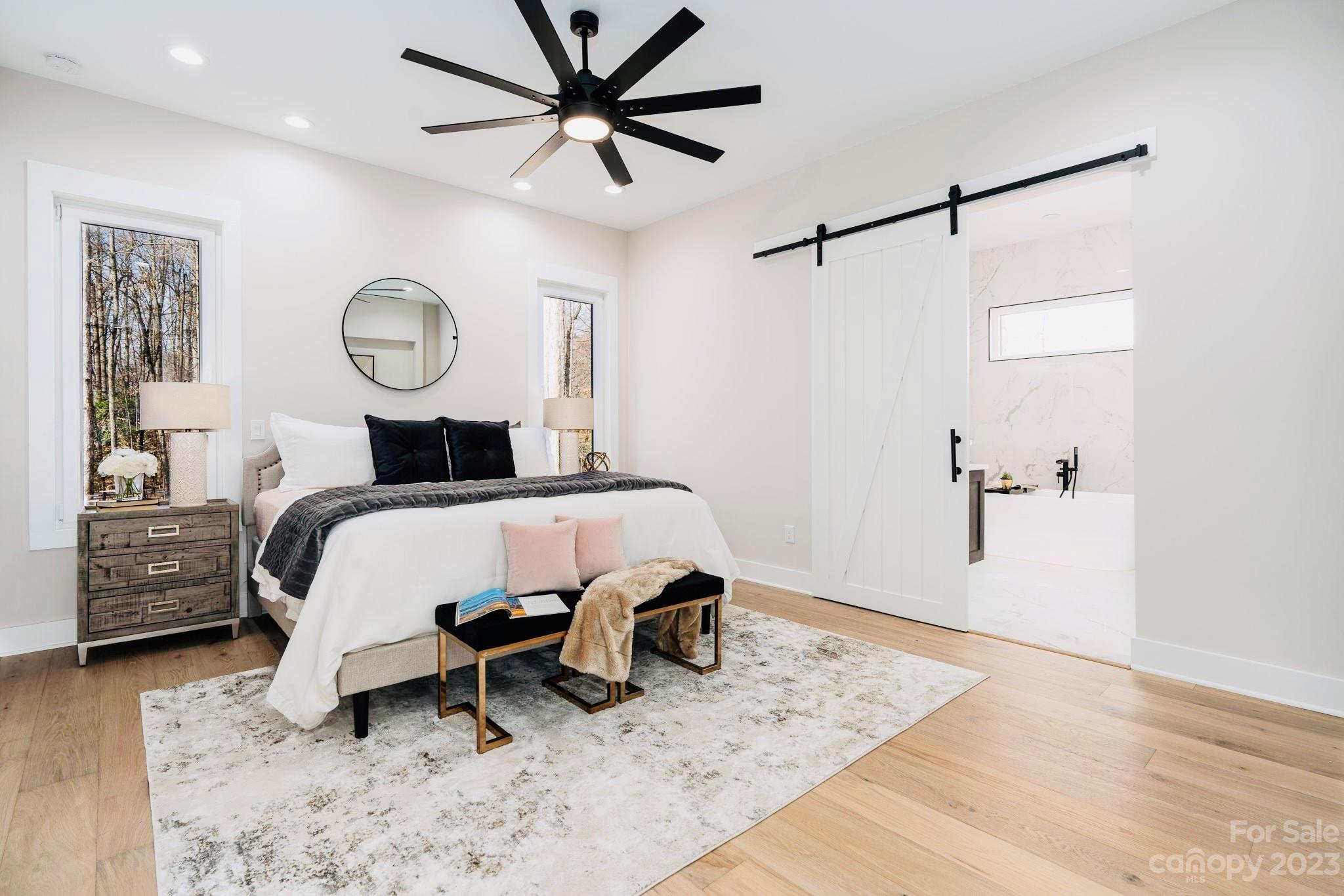 8527 Fieldstone Drive Terrell, NC 28682 - Photo 24 of 48 a bedroom with a bed and a chandelier