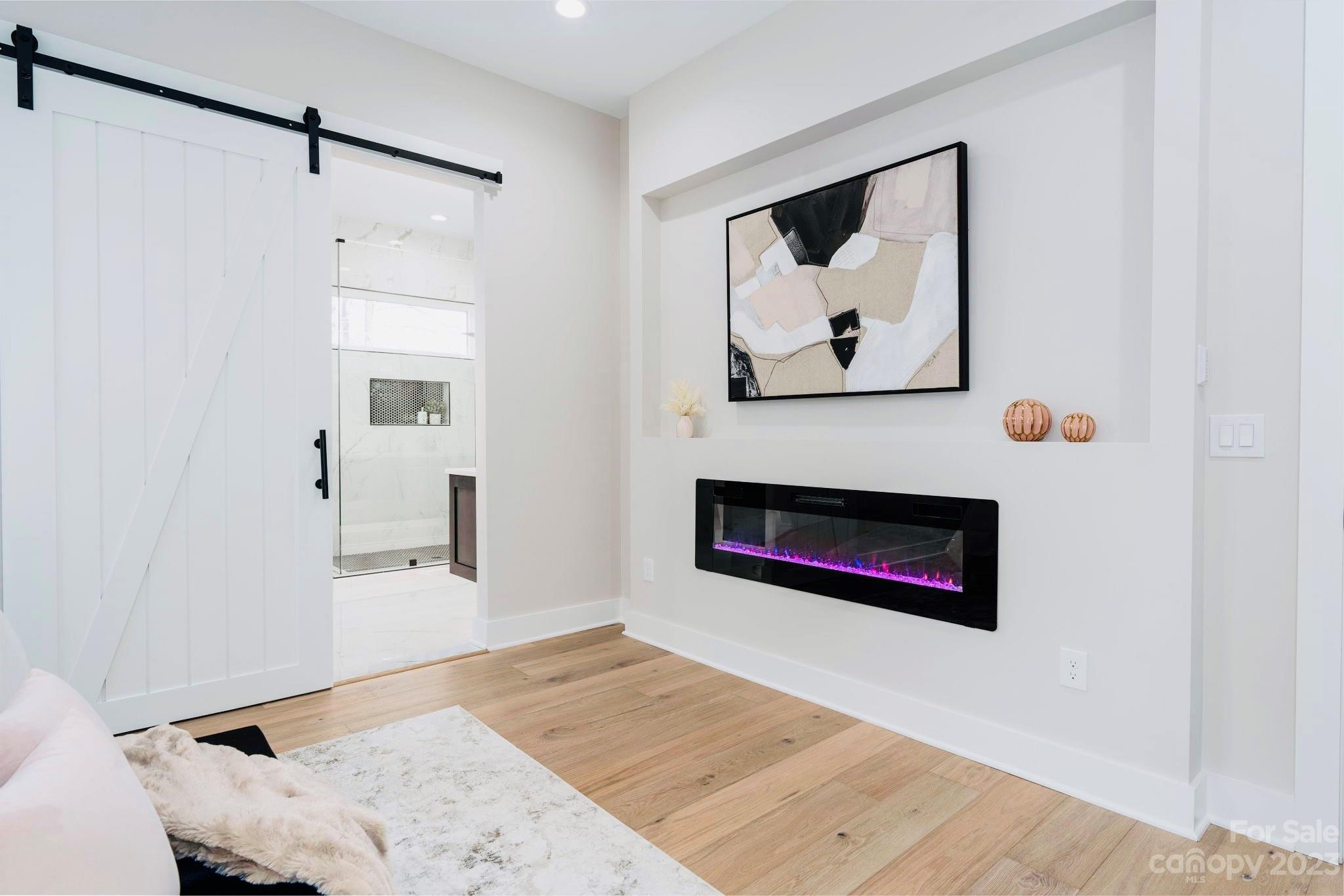 8527 Fieldstone Drive Terrell, NC 28682 - Photo 25 of 48 a picture of a living room with a fireplace and a wooden floor