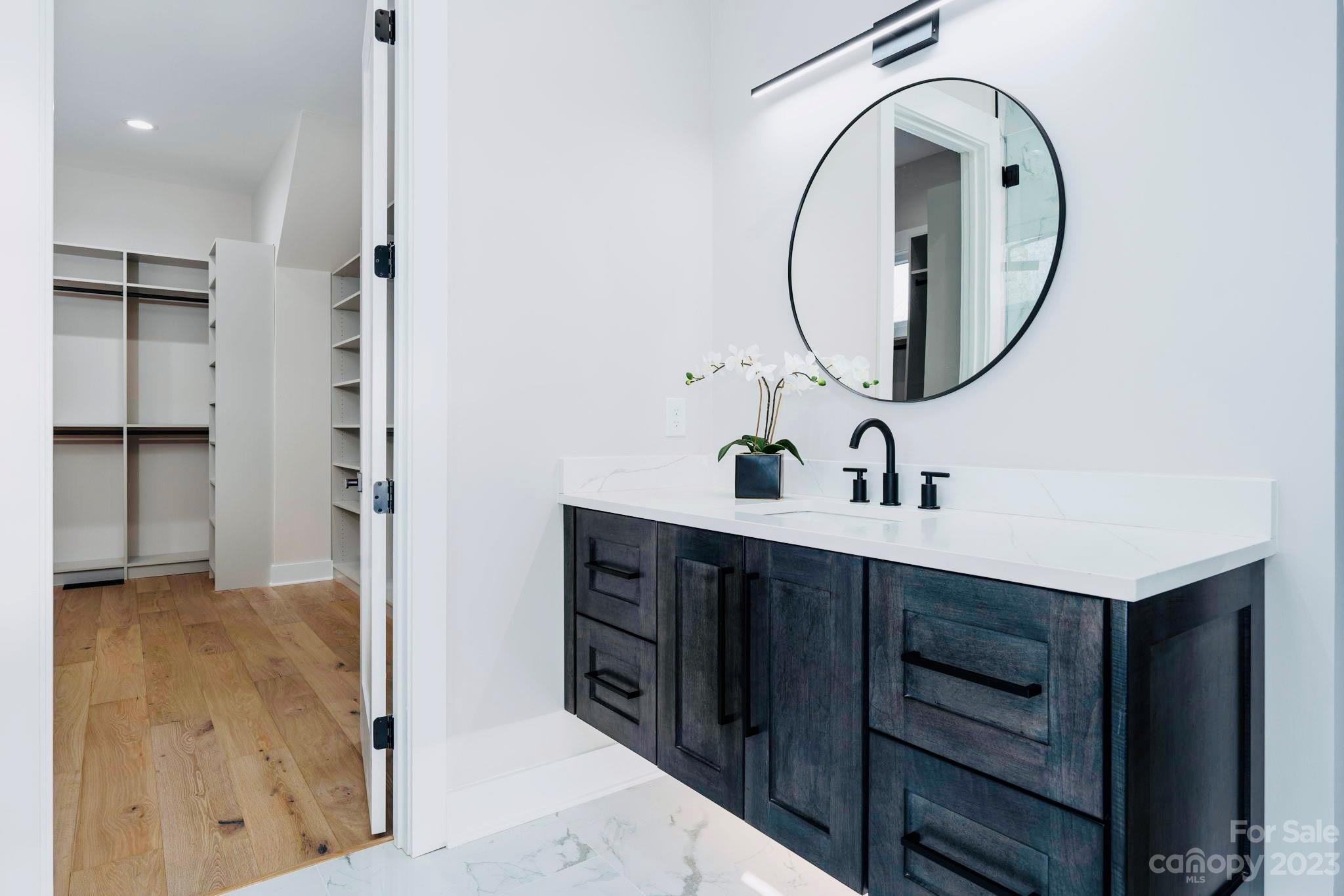 8527 Fieldstone Drive Terrell, NC 28682 - Photo 27 of 48 a spacious bathroom with a sink and a mirror