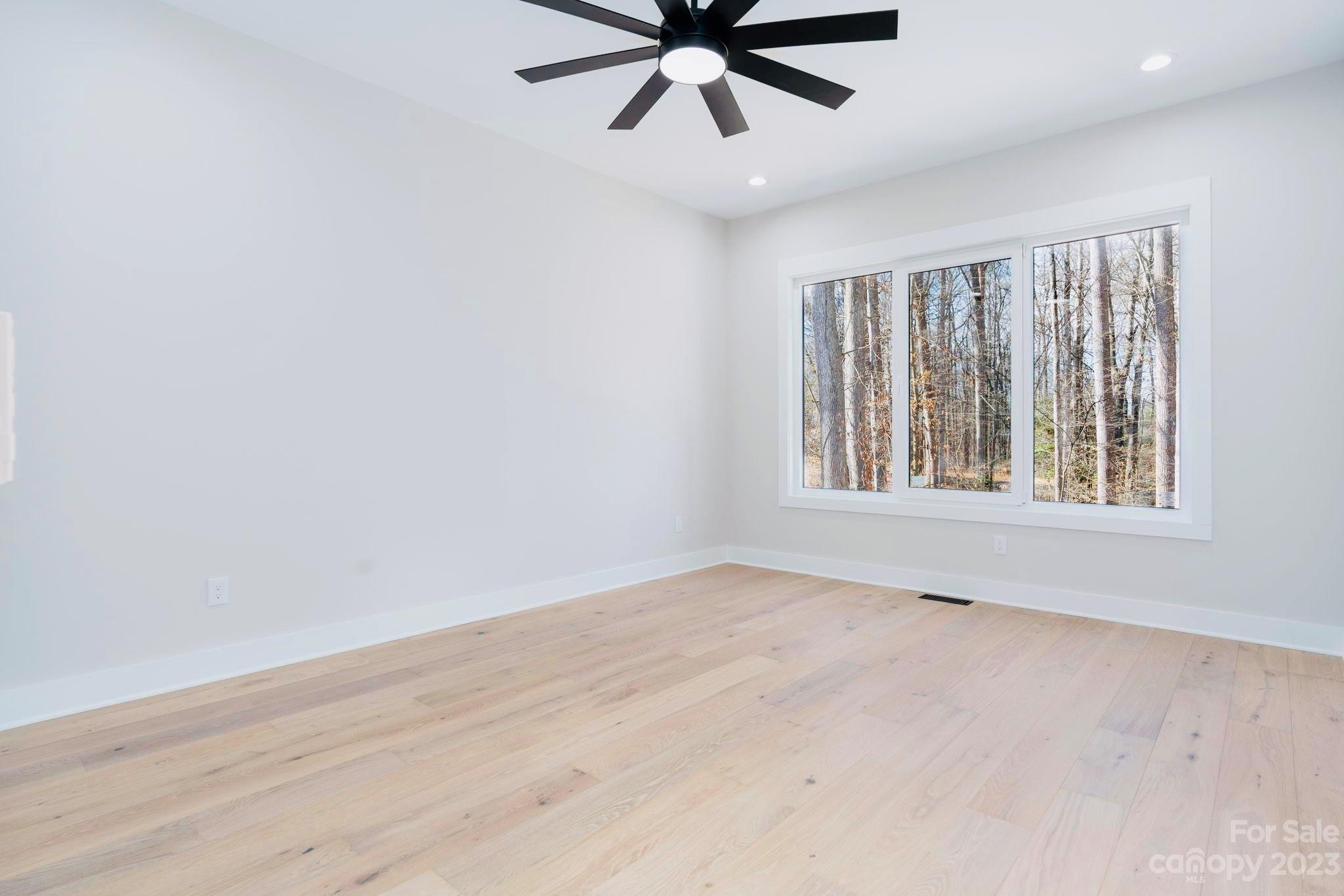 8527 Fieldstone Drive Terrell, NC 28682 - Photo 34 of 48 wooden floor in an empty room with a window