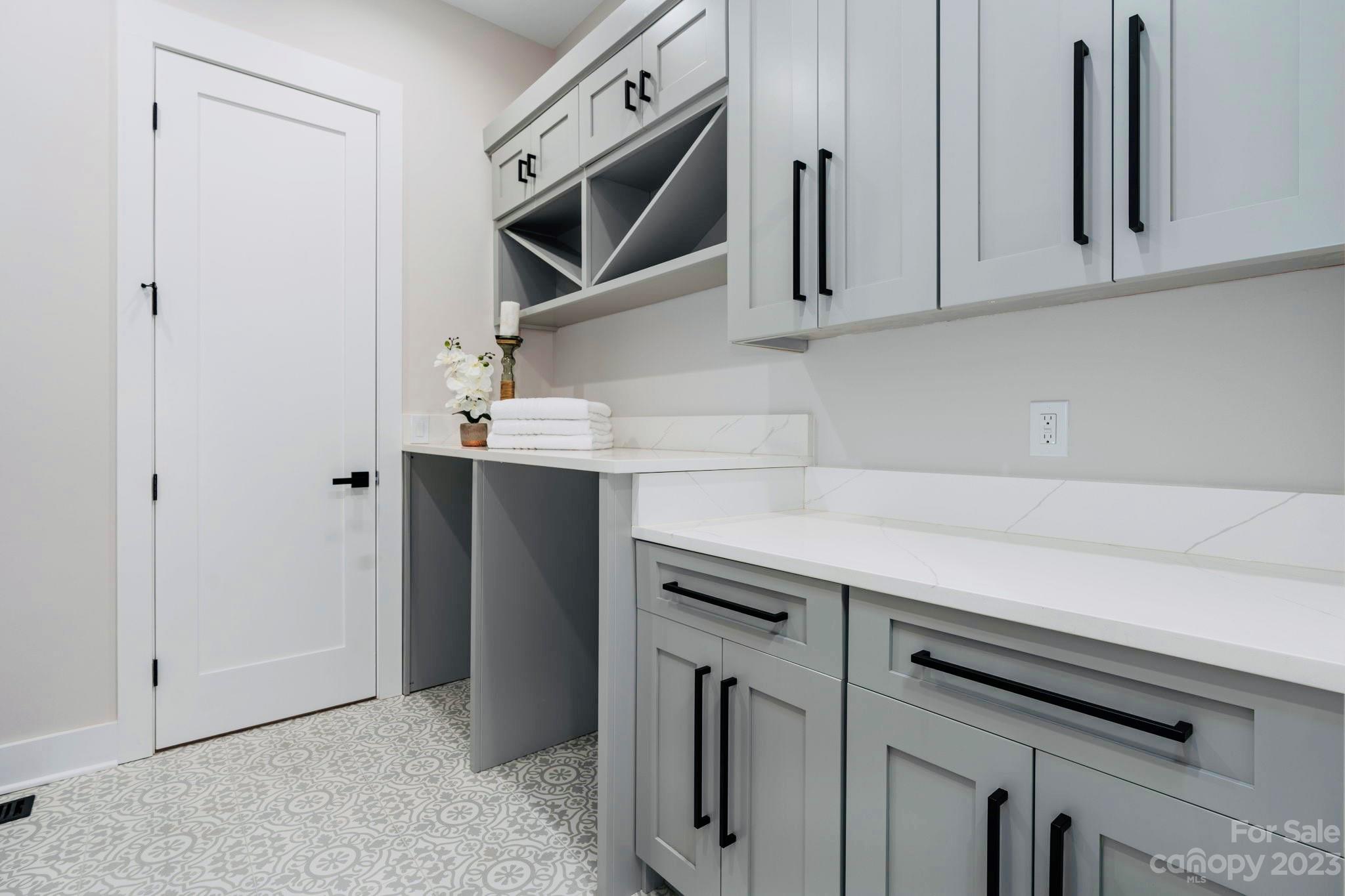8527 Fieldstone Drive Terrell, NC 28682 - Photo 39 of 48 a kitchen with stainless steel appliances white cabinets and a sink