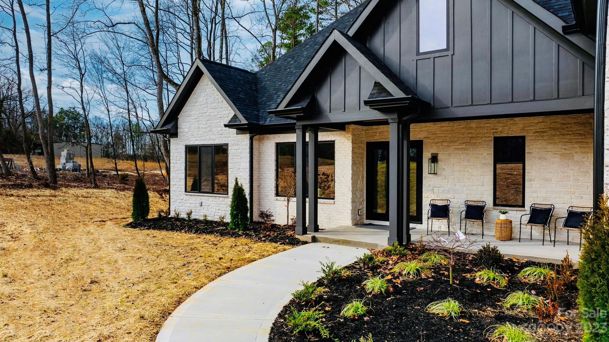 8527 Fieldstone Drive Terrell, NC 28682 - Photo 4 of 48 a front view of a house with garden