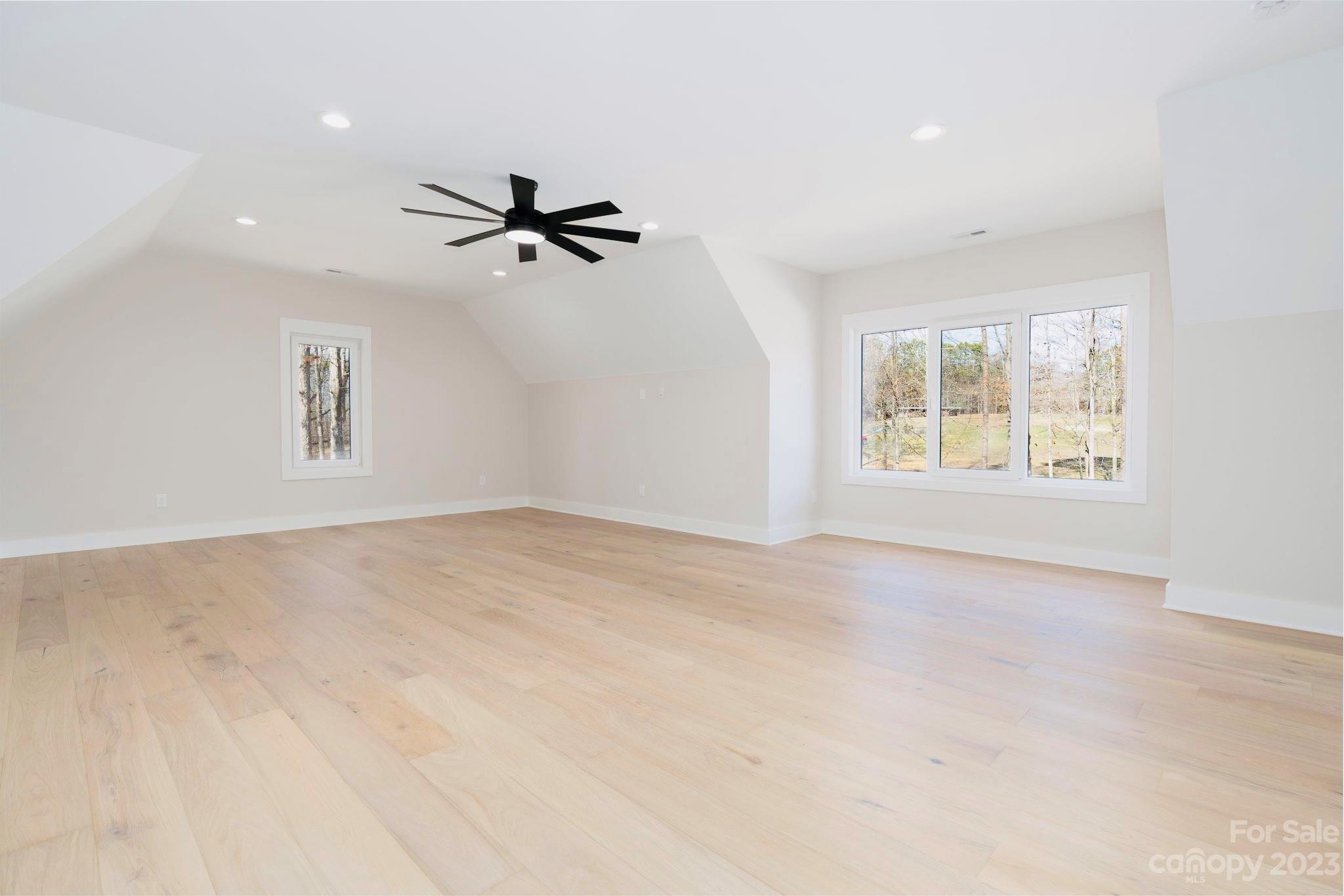 8527 Fieldstone Drive Terrell, NC 28682 - Photo 42 of 48 an empty room with windows and fan