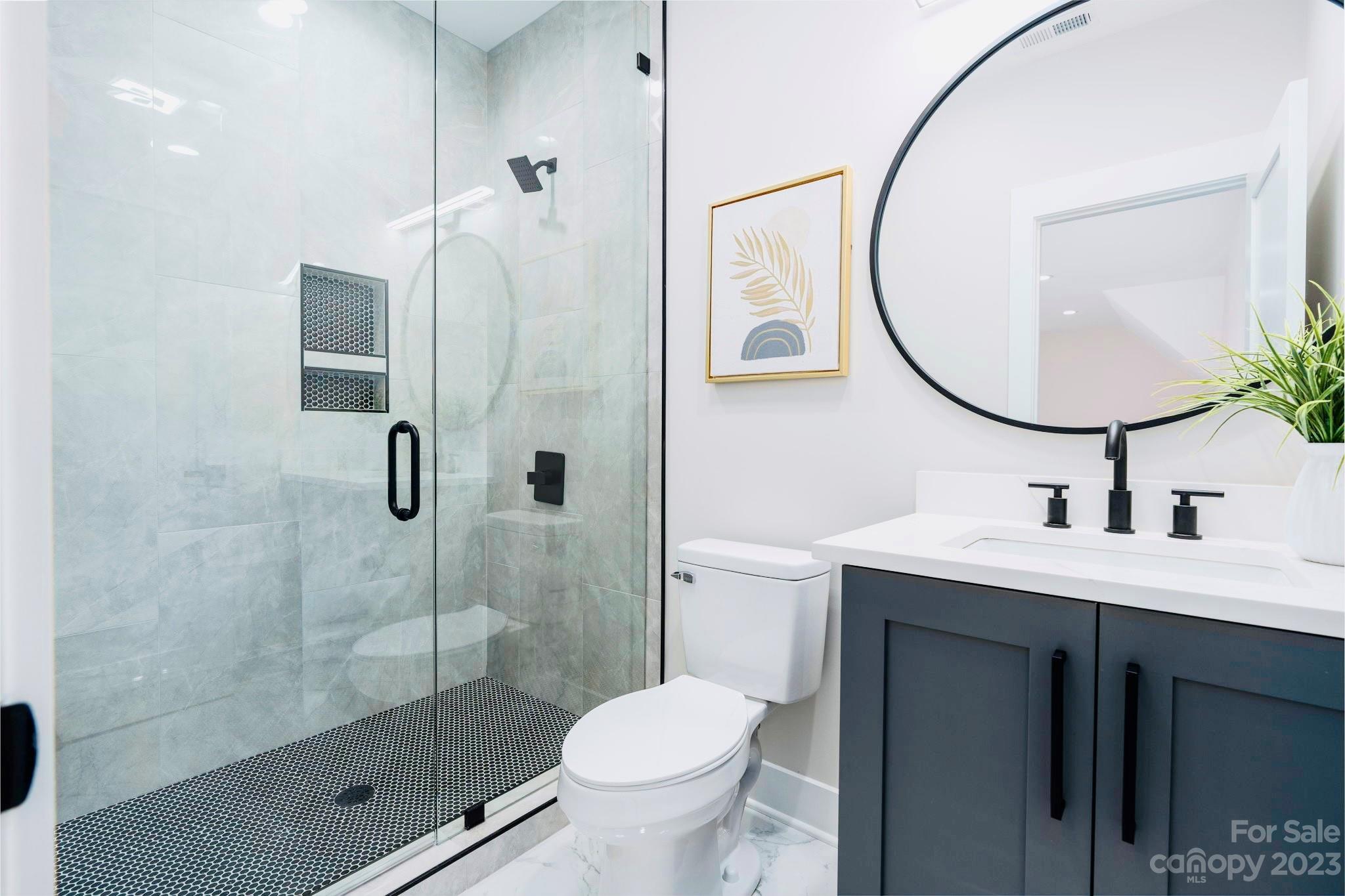 8527 Fieldstone Drive Terrell, NC 28682 - Photo 43 of 48 a bathroom with a sink toilet and shower