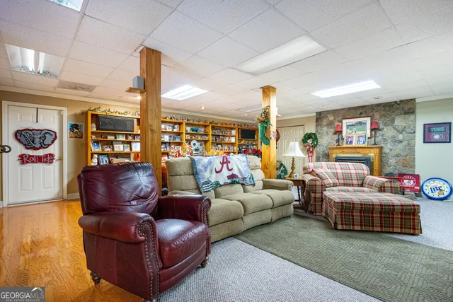 a work room with furniture and a floor to ceiling window