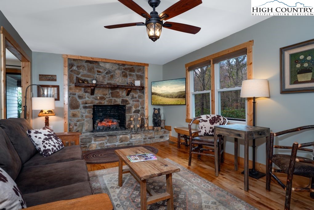 25 Red Oak Road Newland, NC 28657 - Photo 22 of 45 a living room with furniture a table and a fireplace
