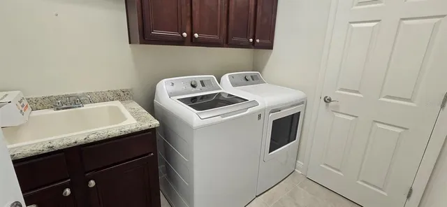 a utility room with dryer and washer