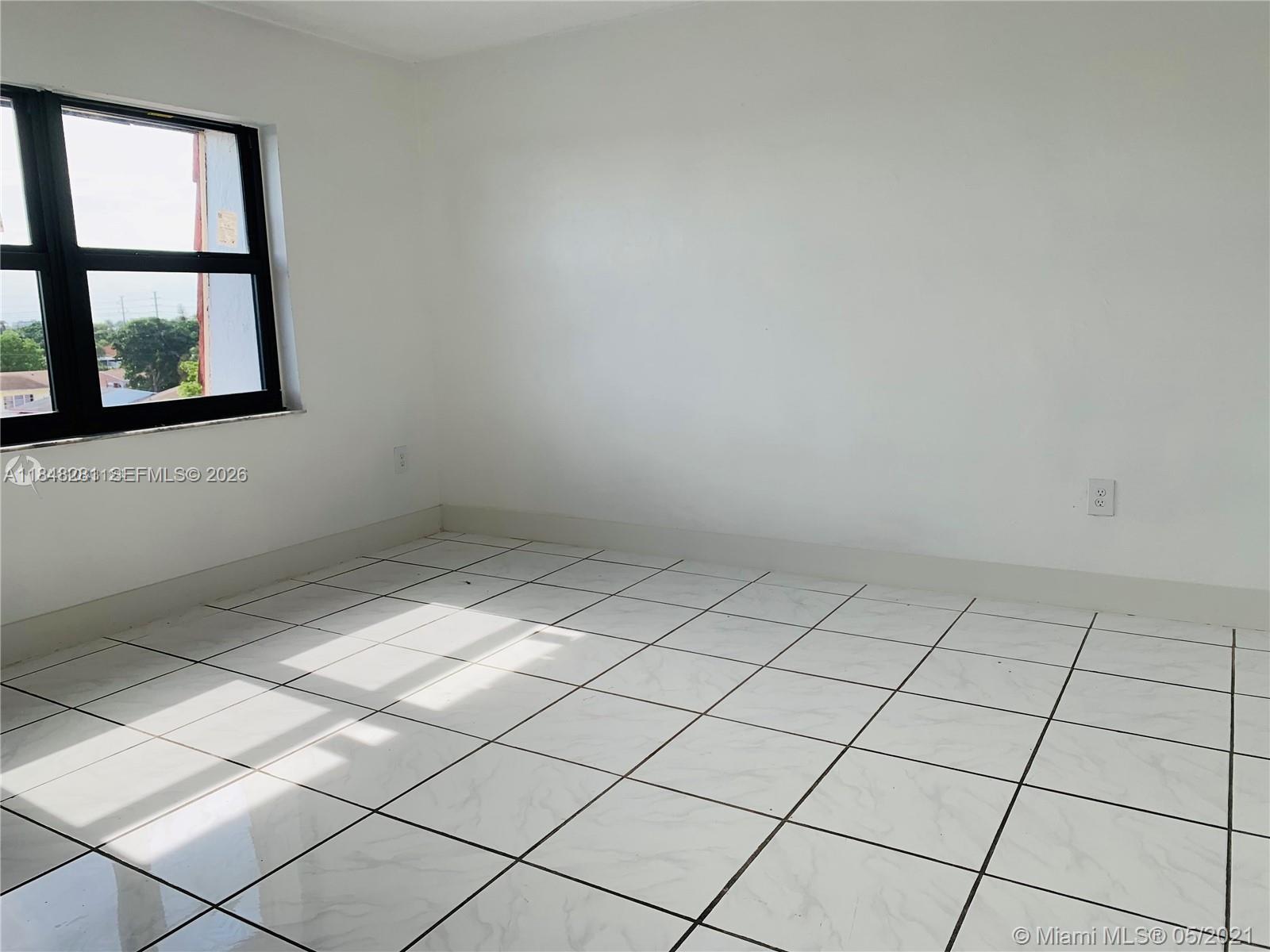 1325 West 68th Street, Unit 514 Hialeah, FL 33014 - Photo 14 of 20 a view of room and window