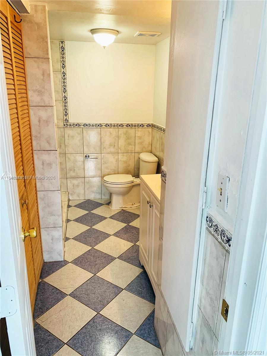 1325 West 68th Street, Unit 514 Hialeah, FL 33014 - Photo 16 of 20 a bathroom with a sink and a mirror