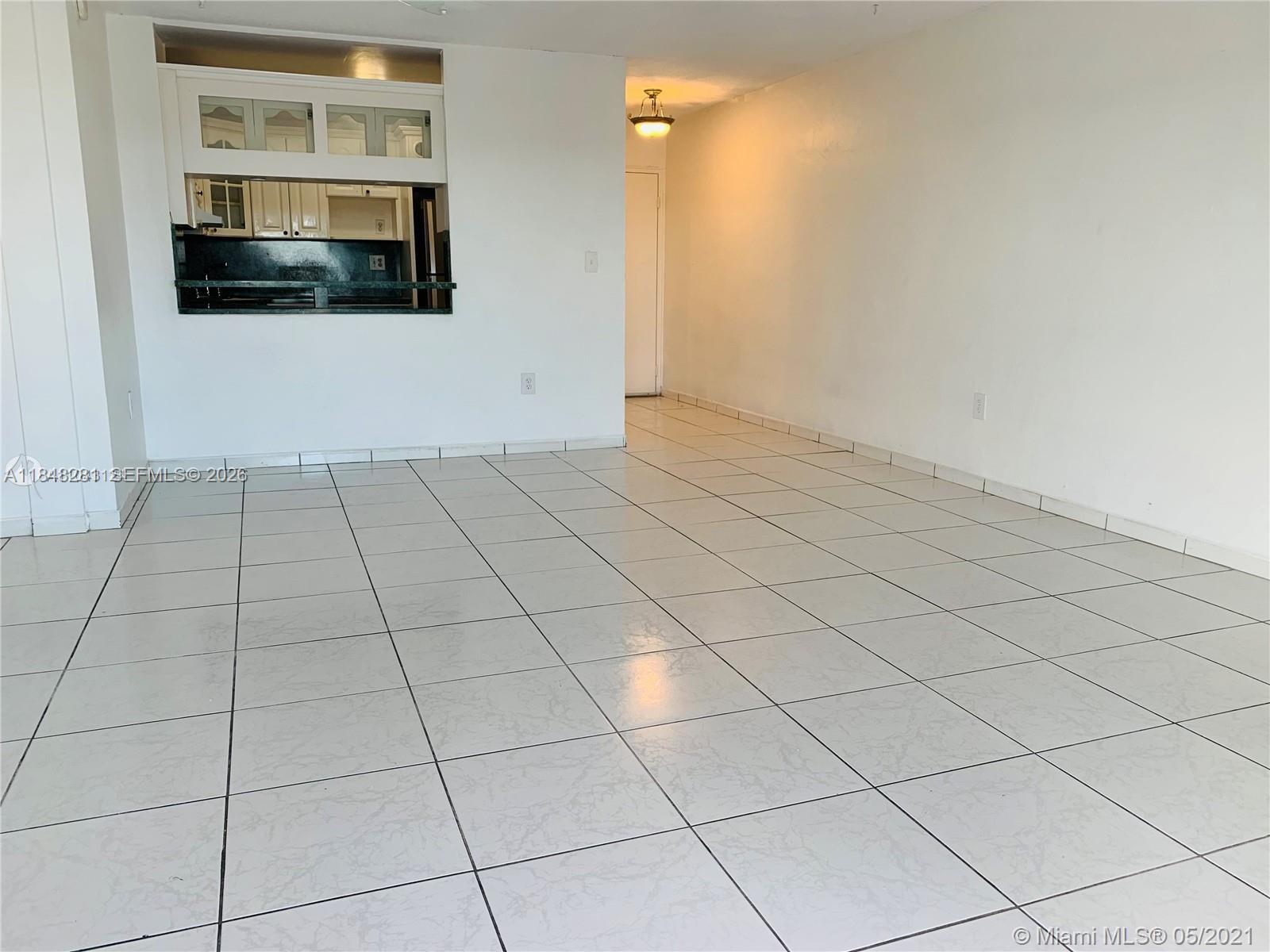 1325 West 68th Street, Unit 514 Hialeah, FL 33014 - Photo 6 of 20 a view of an empty room with a window