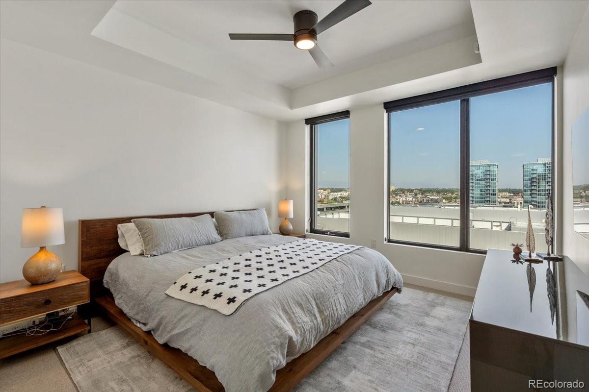 1750 Wewatta Street, Unit 1701 Denver, CO 80202 - Photo 15 of 35 a bedroom with a bed and large window