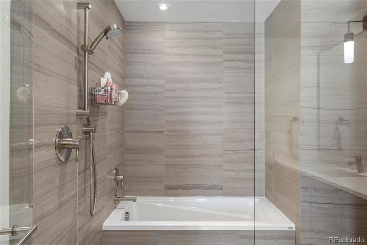1750 Wewatta Street, Unit 1701 Denver, CO 80202 - Photo 18 of 35 a bathroom with a bathtub