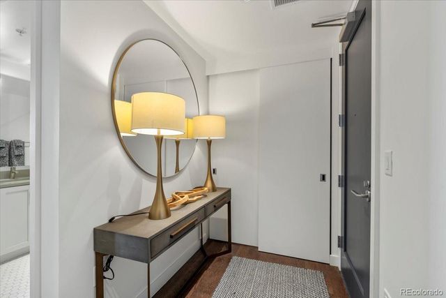 a view of a bathroom with a sink and mirror