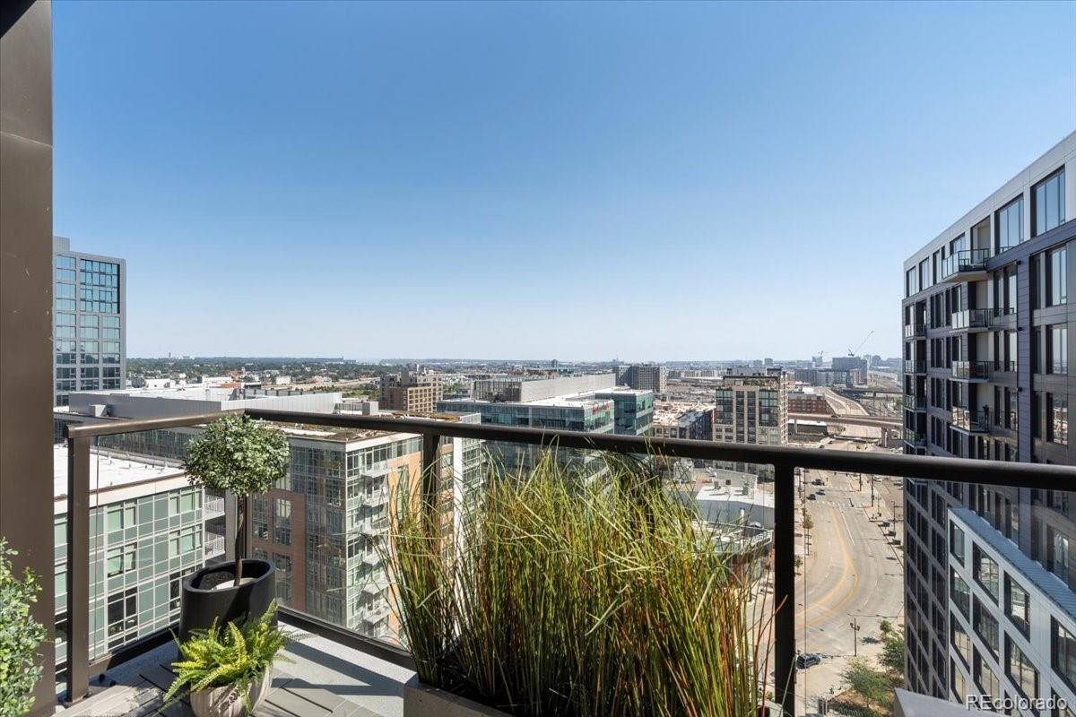 1750 Wewatta Street, Unit 1701 Denver, CO 80202 - Photo 22 of 35 a view of a city skyline from a balcony