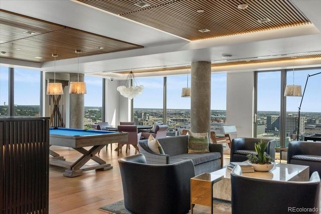 a living room with couches a coffee table and chairs
