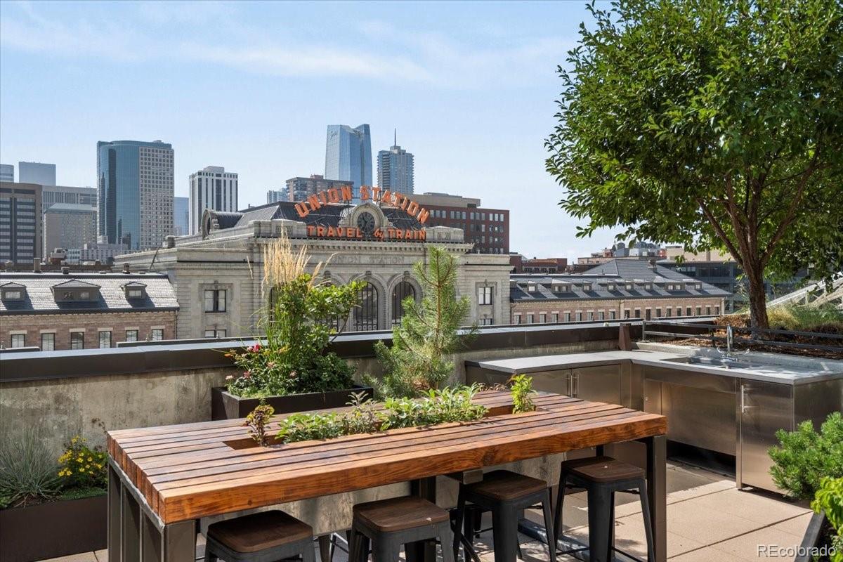 1750 Wewatta Street, Unit 1701 Denver, CO 80202 - Photo 27 of 35 a view of a balcony with a table and chairs