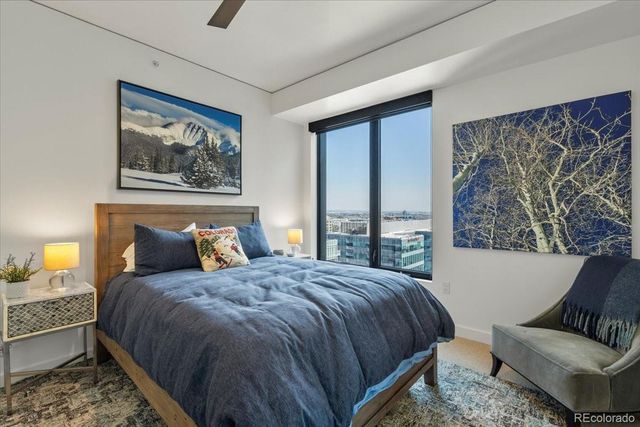 a bedroom with a bed and a couch