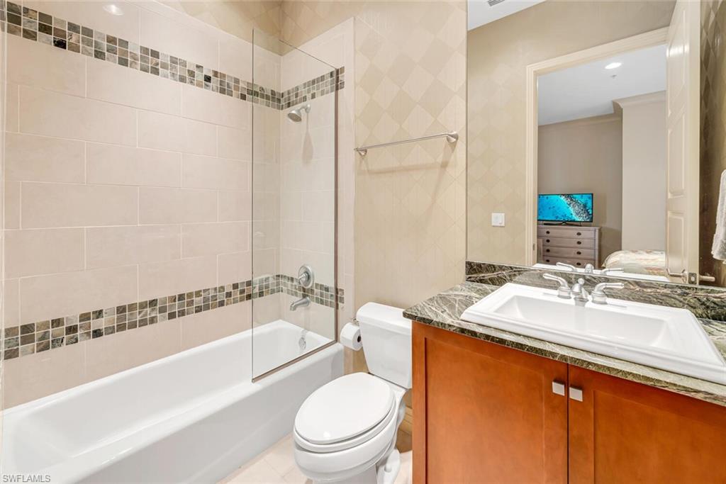 868 5th Avenue South, Unit 3A Naples, FL 34102 - Photo 15 of 21 a bathroom with a granite countertop sink toilet and shower