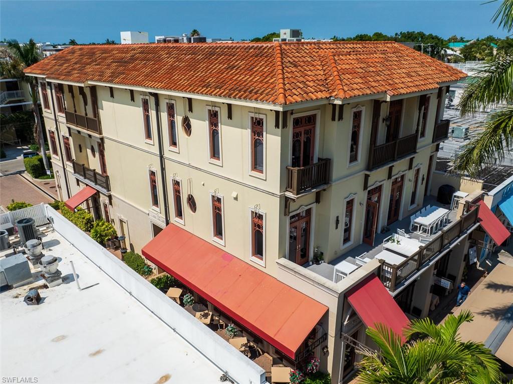 868 5th Avenue South, Unit 3A Naples, FL 34102 - Photo 18 of 21 a view of a chairs and table in the patio
